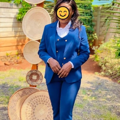 professional portrait of a woman wearing a royal blue suit 